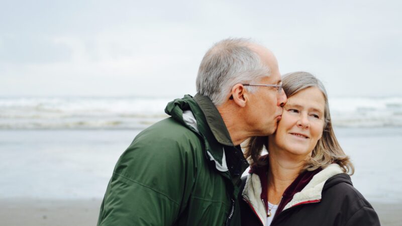 A man kissing a woman on the cheek